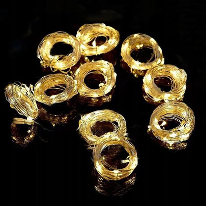 LED aizkaru virtene, 300 LED, 3x3 m, silti baltā / dzeltenā krāsā.